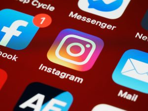 Vibrant close-up of popular social media app icons on a smartphone screen.